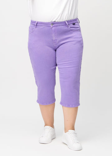 Purple regular capris, model name Lavenders, with a straight leg on a plus-size model, seen from the front.