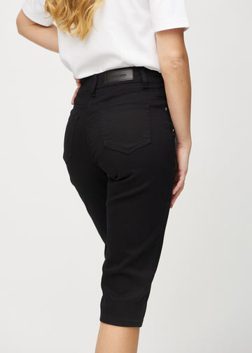 Black regular capris seen from the back close up to show details.
