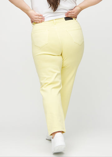 Light yellow regular jeans seen from the back on a plus-size model, so the entire product can be seen.