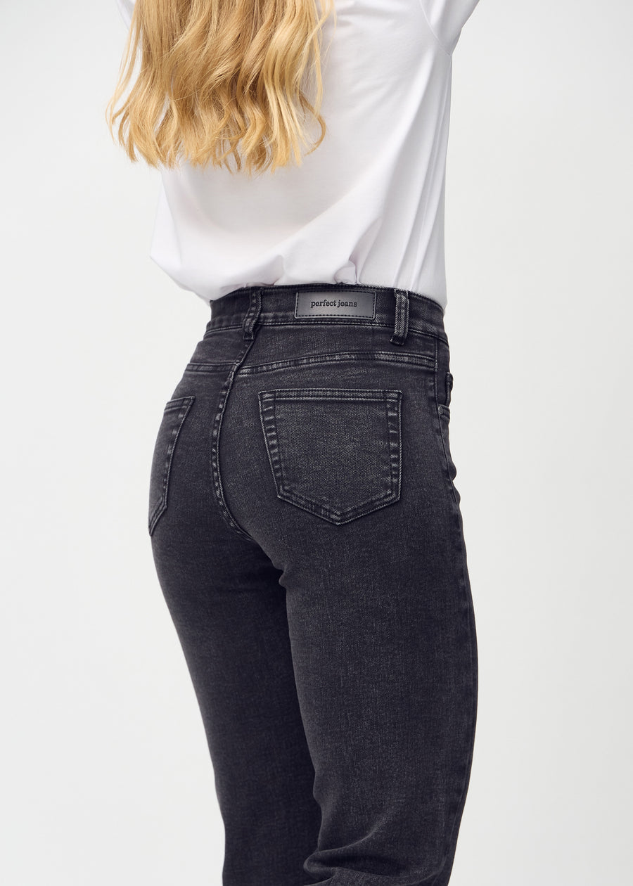 Regular jeans for women in dark grey, color Shadows. Close-up from behind on a model, showing fit and details.