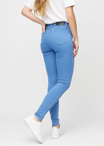 Skinny jeans for women in blue, color Geraniums. Back view on a model, showing the overall fit.