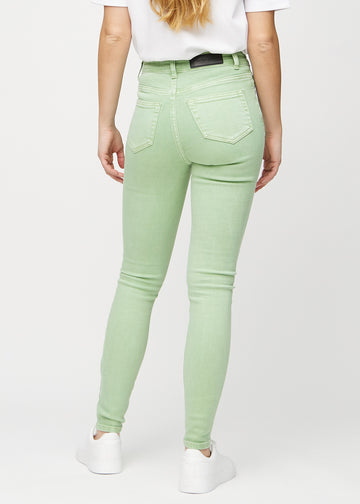 Skinny jeans for women in light green, color Mints. Back view on a model, showing the full fit.