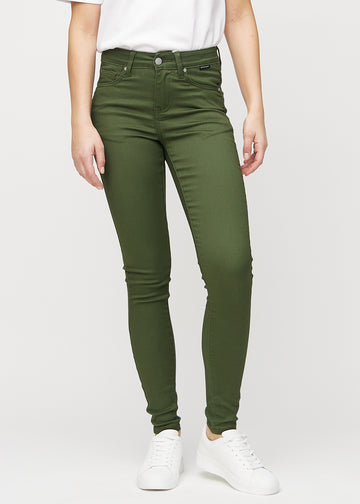 Skinny jeans for women in dark green, color Renewals. Front view on a model, showing the close fit through the legs.