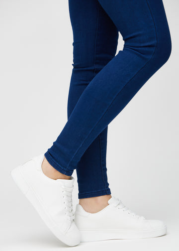 The ankles of a model, so you can see how tightly the jeans fit.