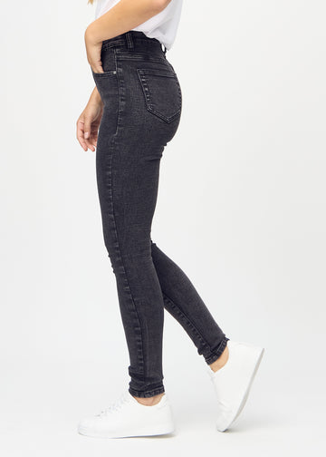 Skinny jeans for women in dark grey, color Shadows. Side view on a model.