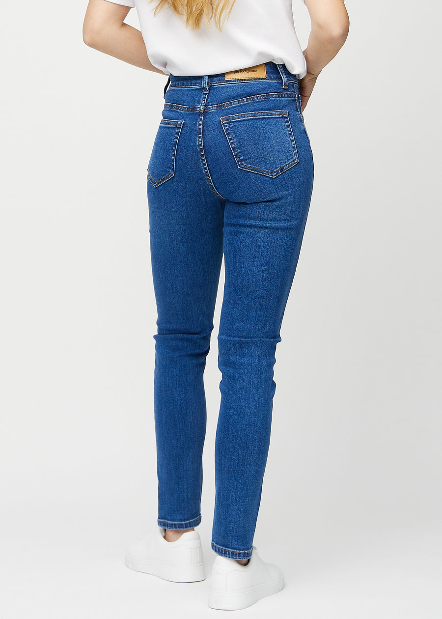 Slim jeans for women in dark blue, color Oceans. Back view on a model, showing the overall fit.