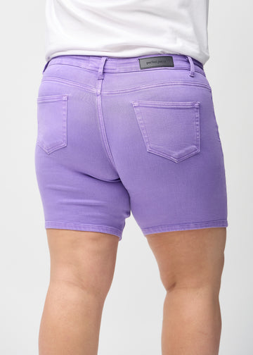Purple skinny short shorts seen from the back close up on a plus-size model to show details.