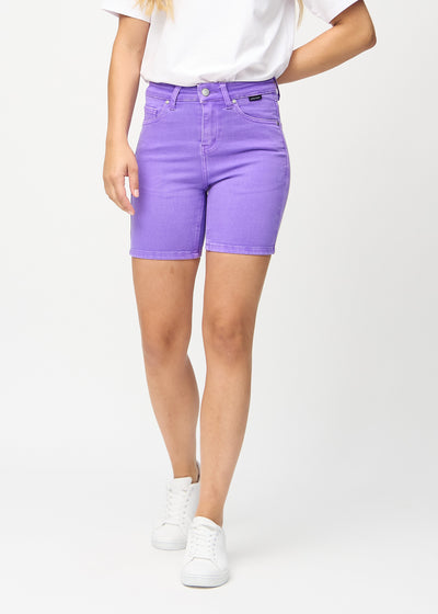 Purple skinny short shorts, style name Lavenders, with a tight fit and ending mid-thigh, seen from the front.