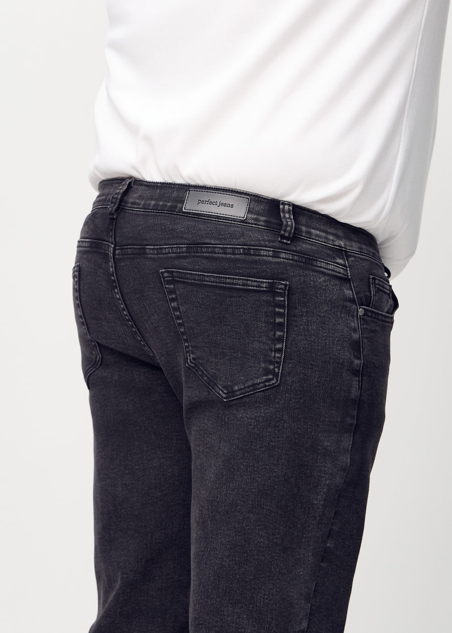 Dark grey denim regular jeans viewed from the back close up on a plus-size model to show details.