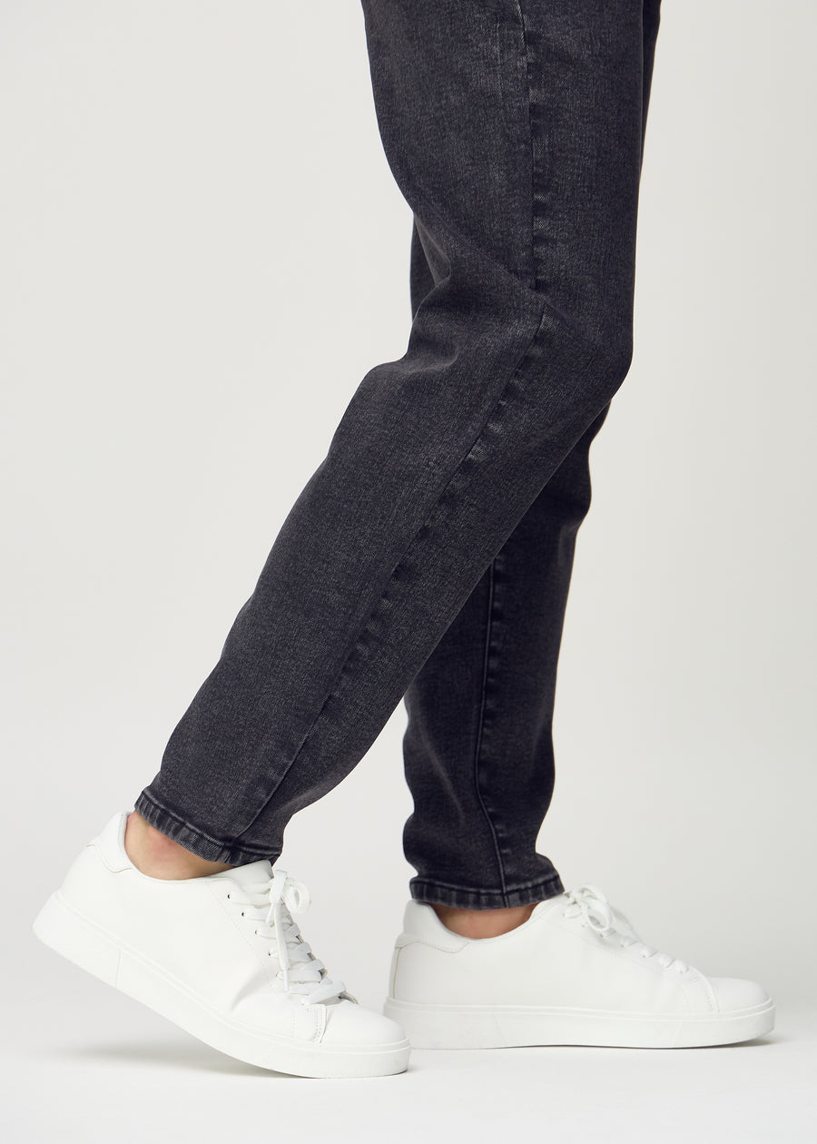 The ankles of a model, so you can see how loose the jeans fit.