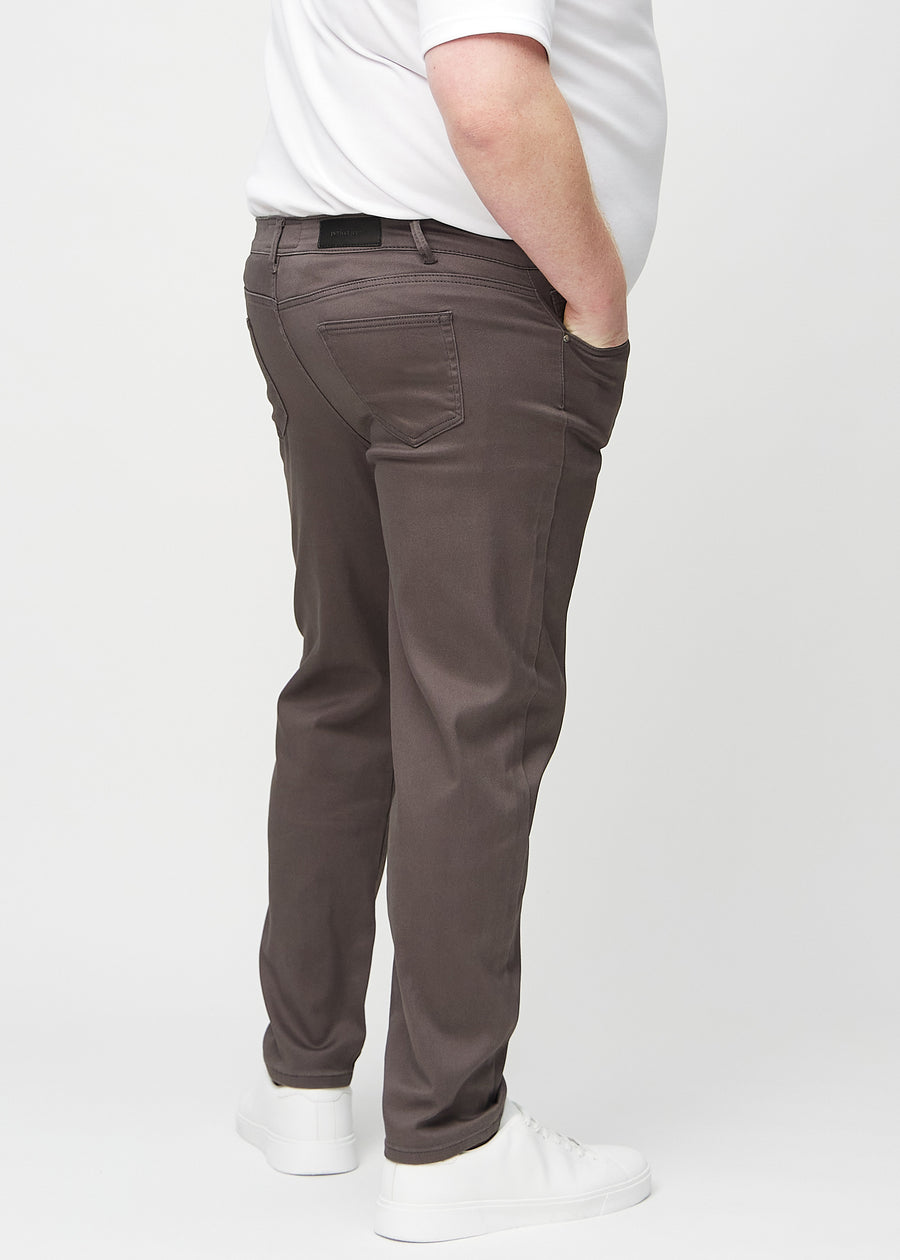 Grey-brown regular jeans seen from the back on a plus-size model, so the entire product can be seen.