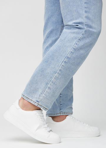 The ankles of a model, so you can see how loose the jeans fit.