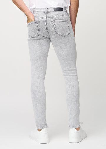 Light grey denim slim jeans viewed from the back to show the full product.