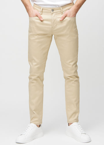 Beige slim jeans, modelnavn Gazelles, som sidder tæt til benet, set forfra.