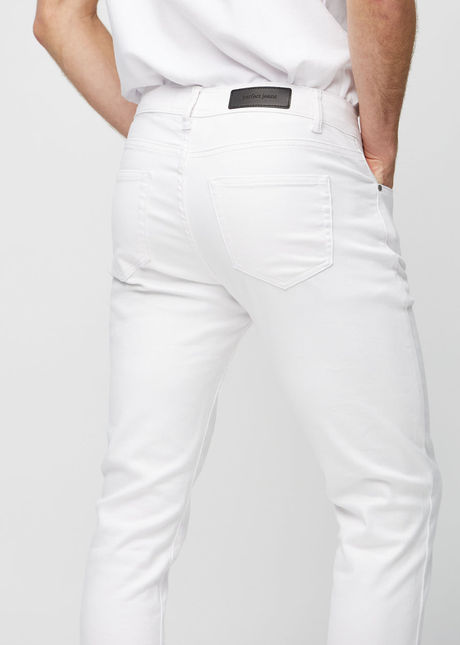 Close-up back view of white slim jeans showing details.