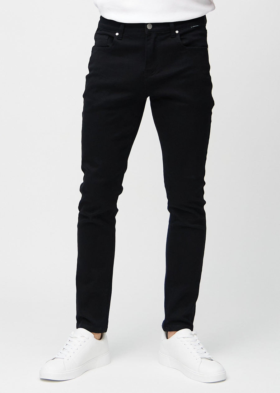 Black slim jeans, model name Ravens, fitted closely along the legs, front view.