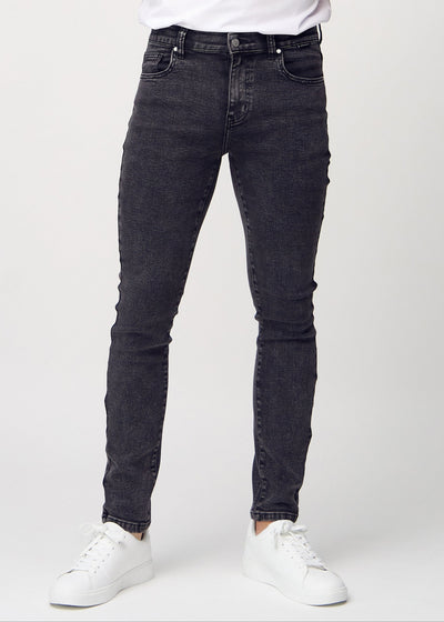 Dark grey denim slim jeans, model name Shadows, fitted closely along the legs , front view.