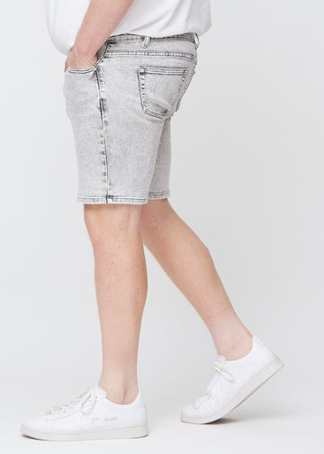 Light grey denim middle-slim shorts seen from the side on a plus-size model.